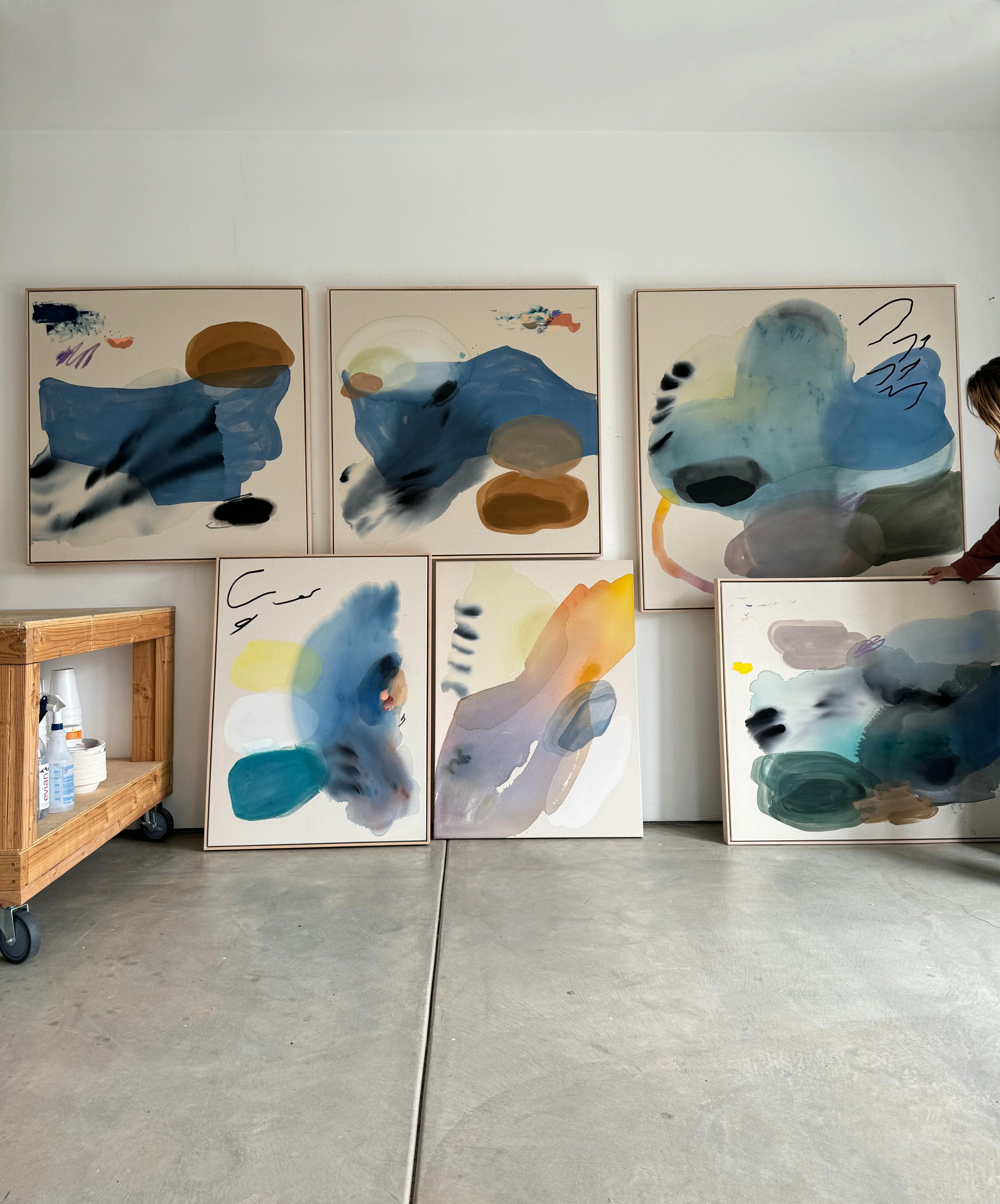 Colorful, gestural brushwork paintings on canvas by artist Karina Bania in her studio.