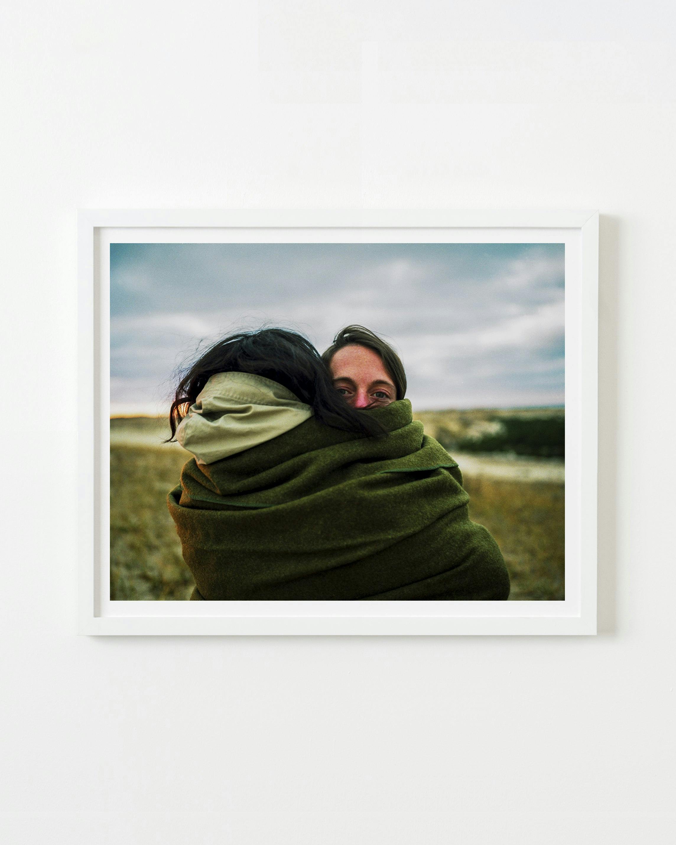 Photography by Nick Meyer titled "Alexis and Lydia Hugging".