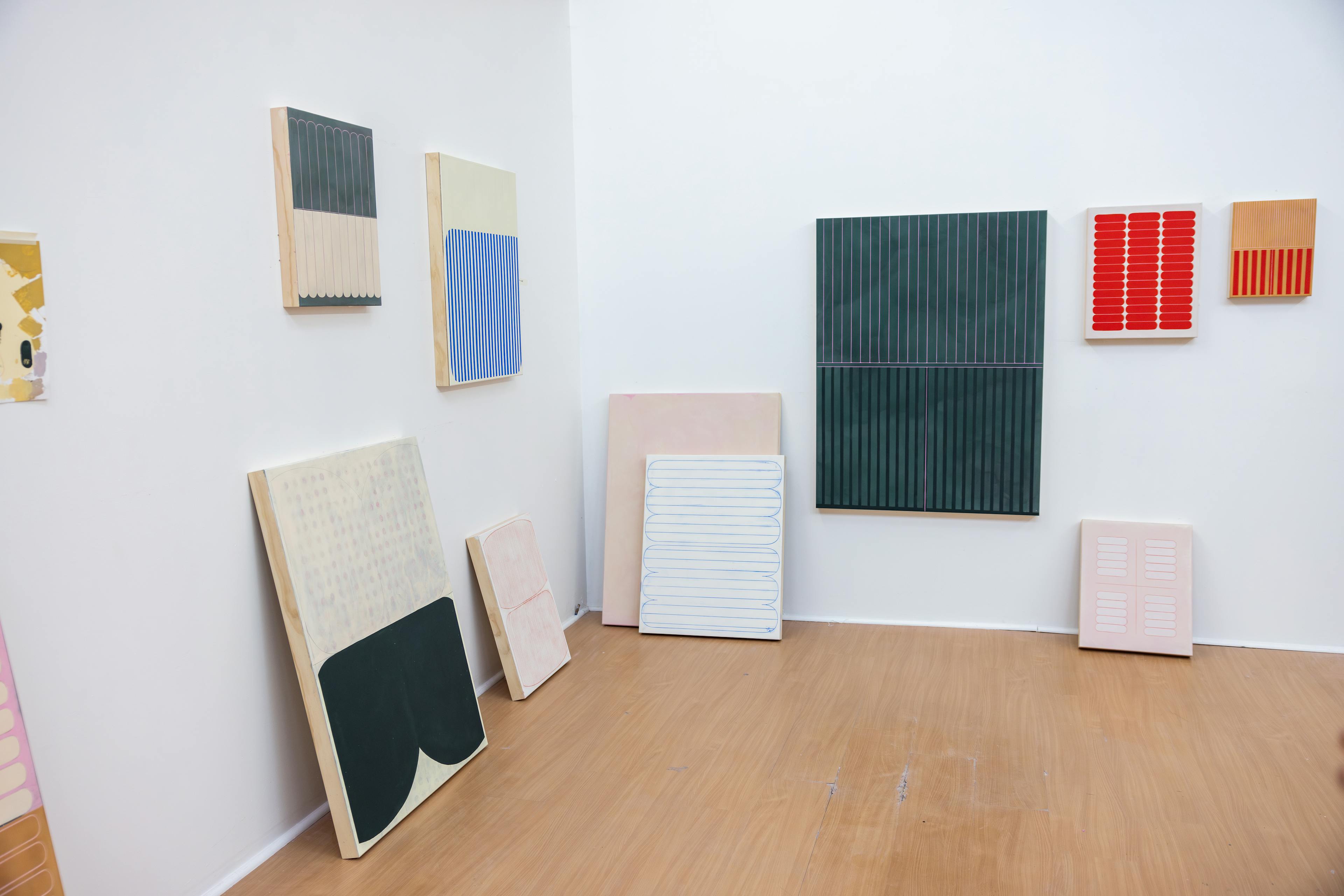 Abstract, minimalist paintings on panel in artist Arielle Zamora's studio.