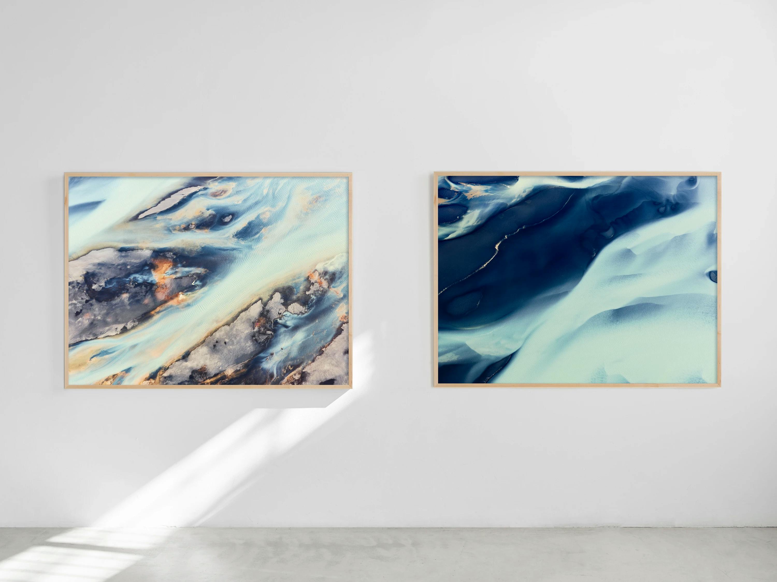 Two photographs of Icelandic rivers by Brooke Holm displayed in gallery