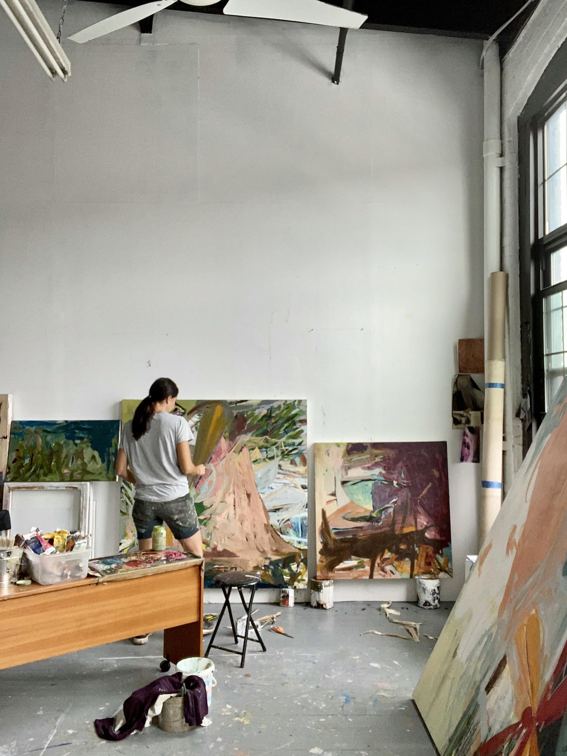 Artist Diana Delgado painting large, abstract gestural paintings in her Yonkers studio.