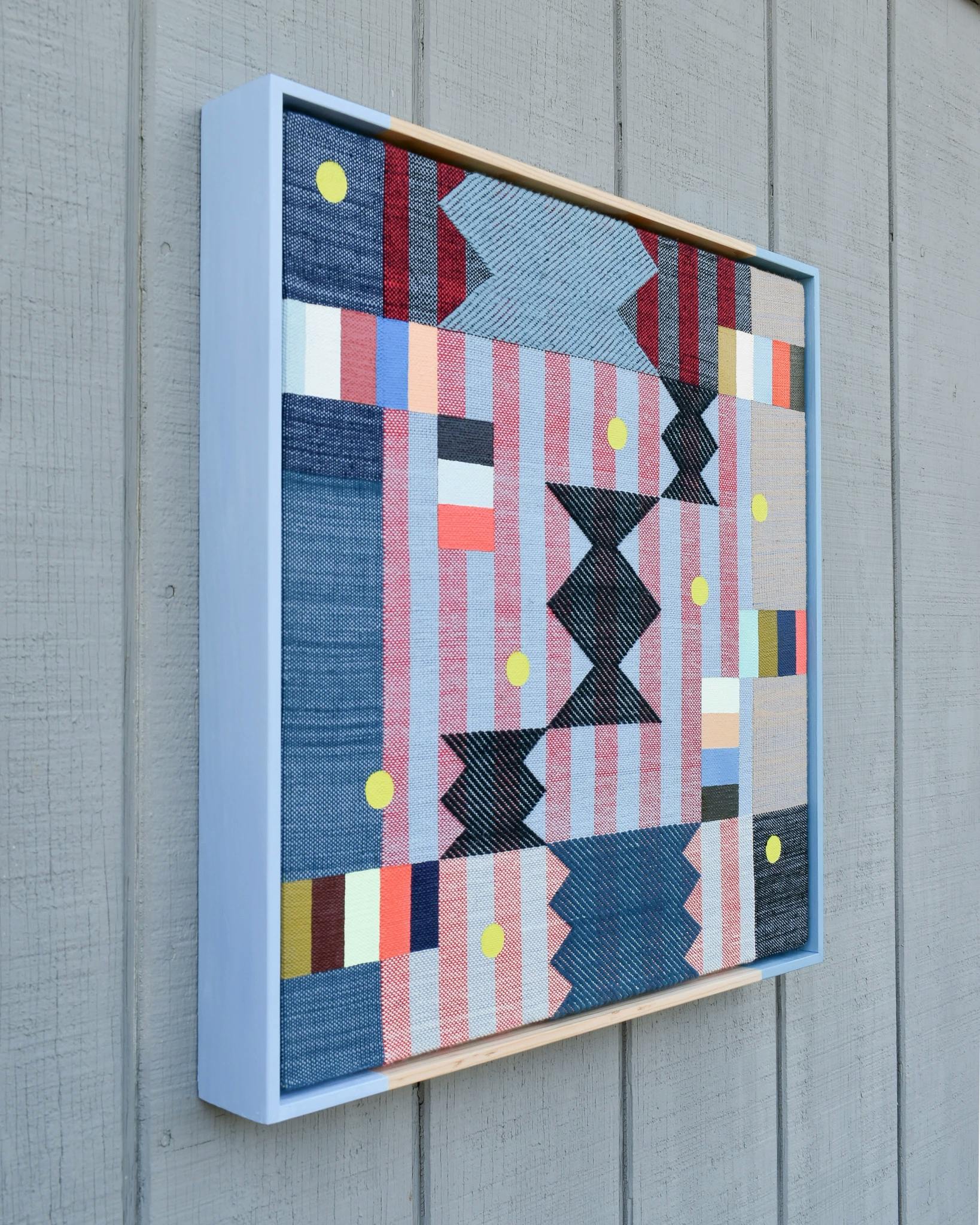 Multicolored acrylic painting on handwoven textiles in a hand-painted frame by artist Sarah Sullivan Sherrod.