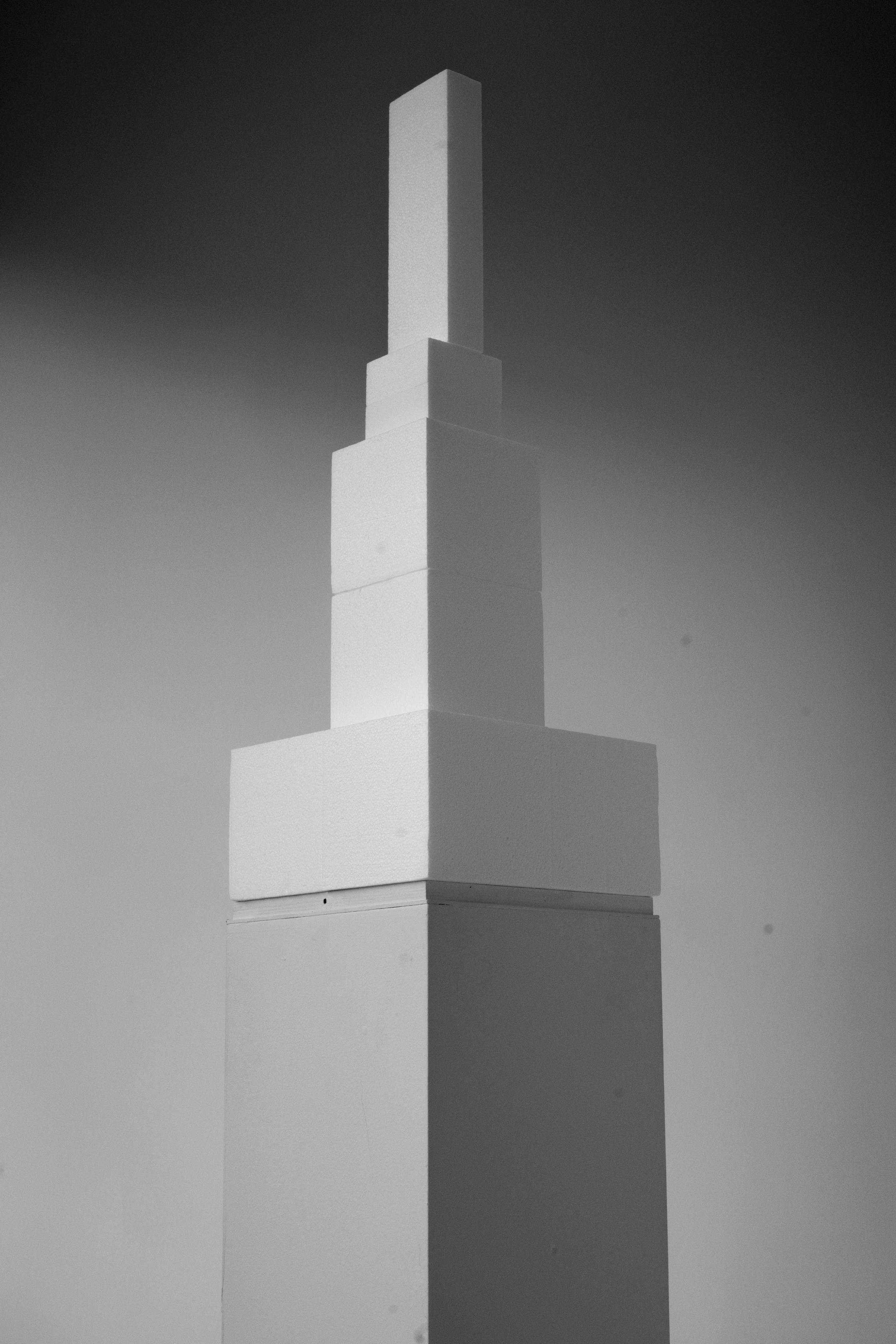 Black and white print with a styrofoam tower by artist Adam Ryder.
