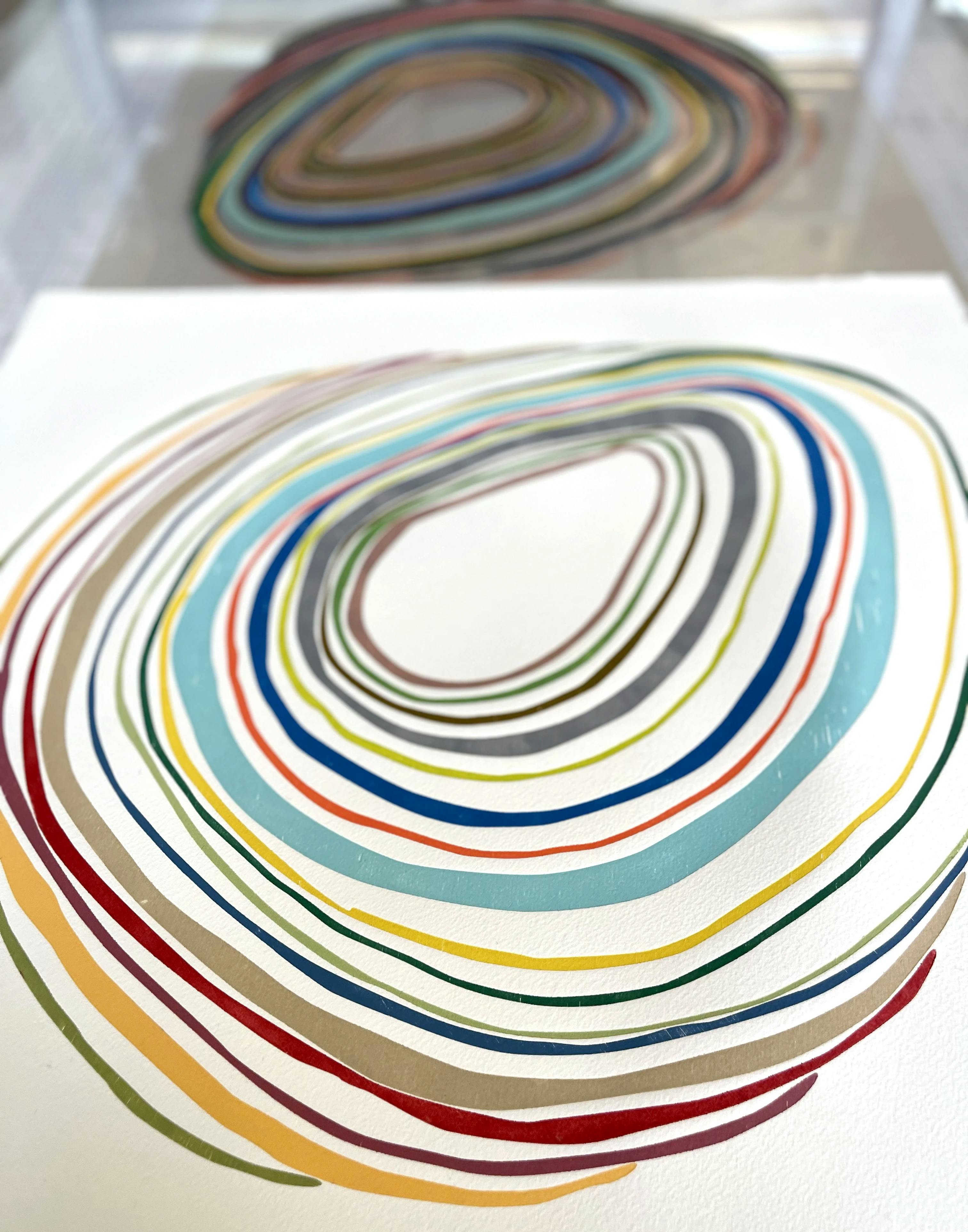 In progress relief monoprint with concentric, colorful circles by artist Laura Berman.