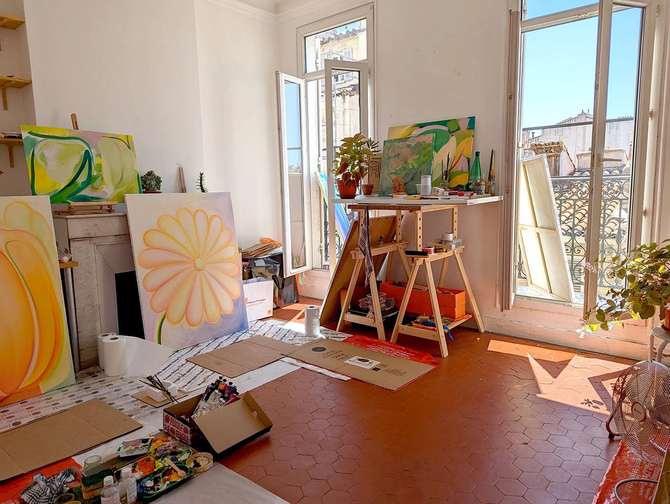 Roche's sun-filled studio, featuring works in progress leaned against the wall.