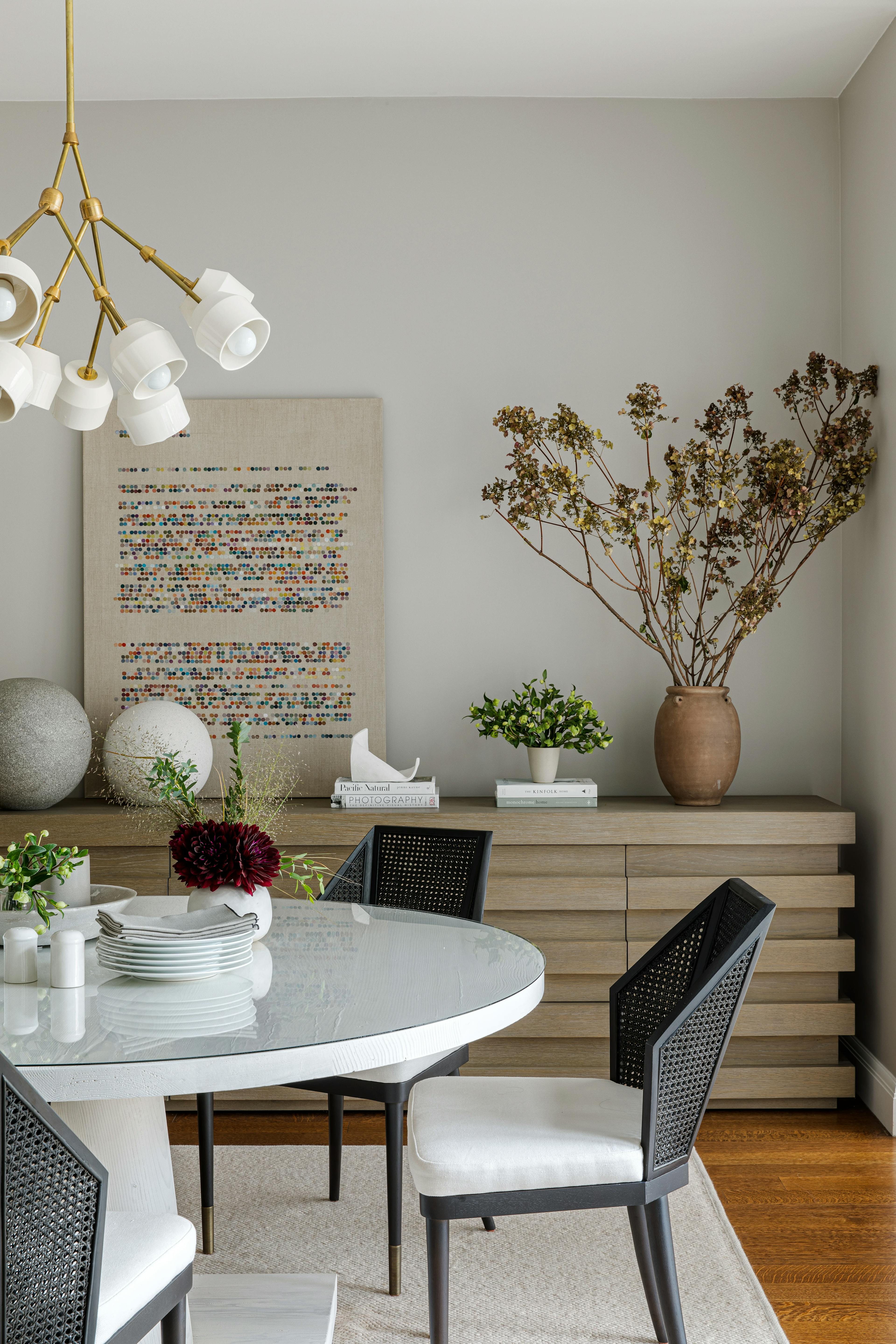 Abstract artwork with coded language by artist Gail Tarantino in a modern dining room.