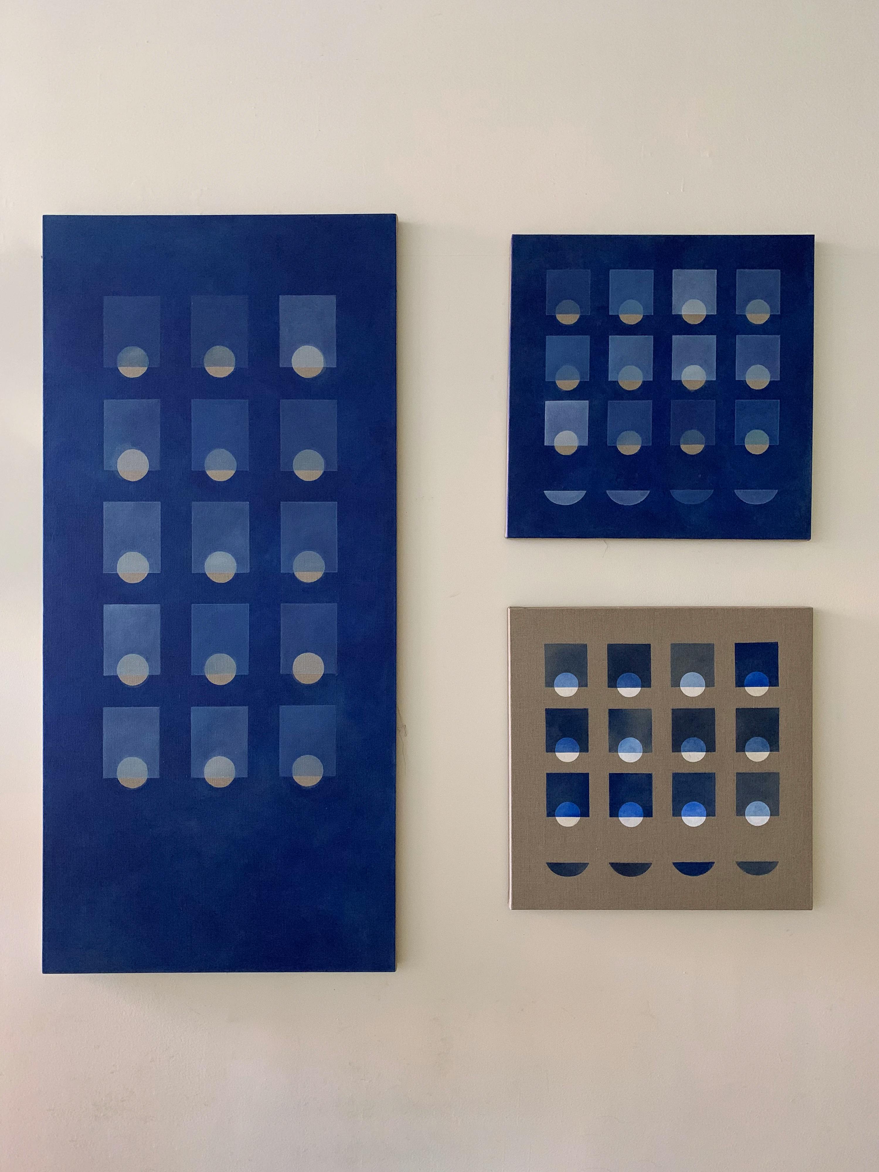 Three minimalist paintings with geometric grids by artist Carla Weeks installed on a white wall.