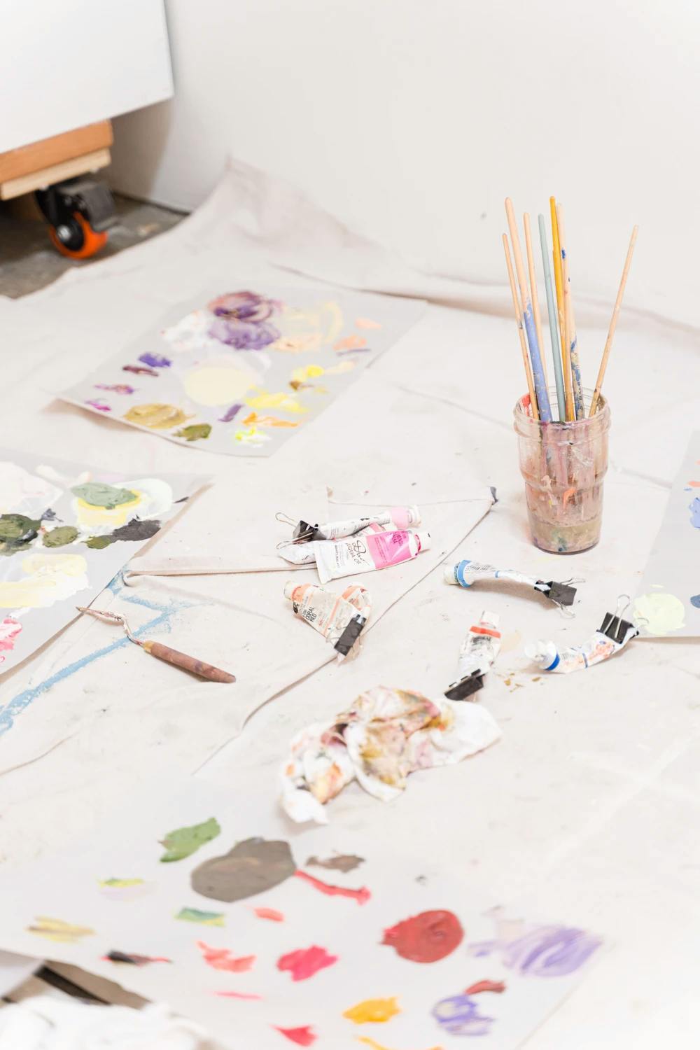 Paintbrushes, tubes of paint and a palette in Artist Erin Lynn Welsh's studio. 