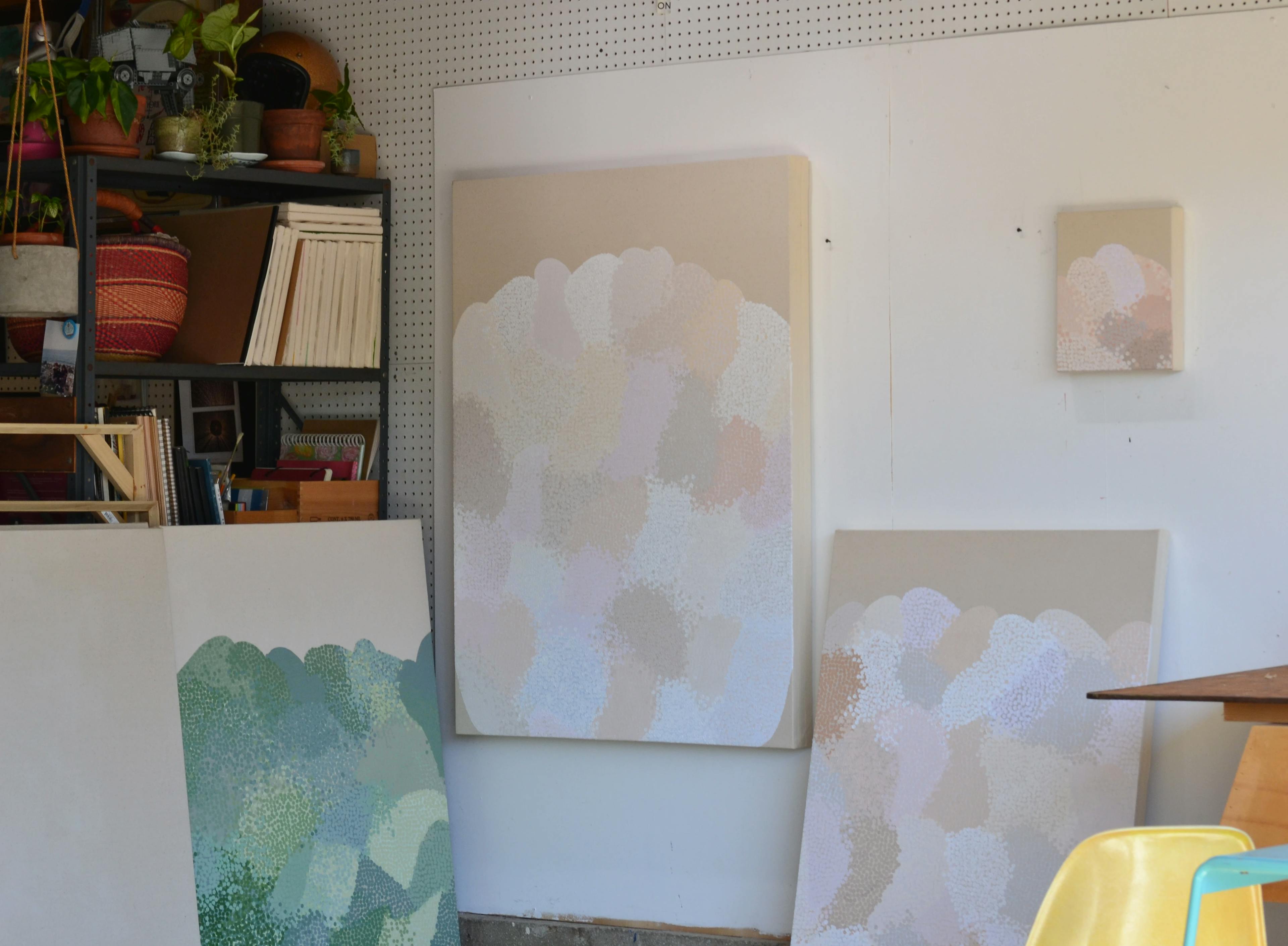 Neutral dot paintings on the wall at Misato Suzuki's studio.