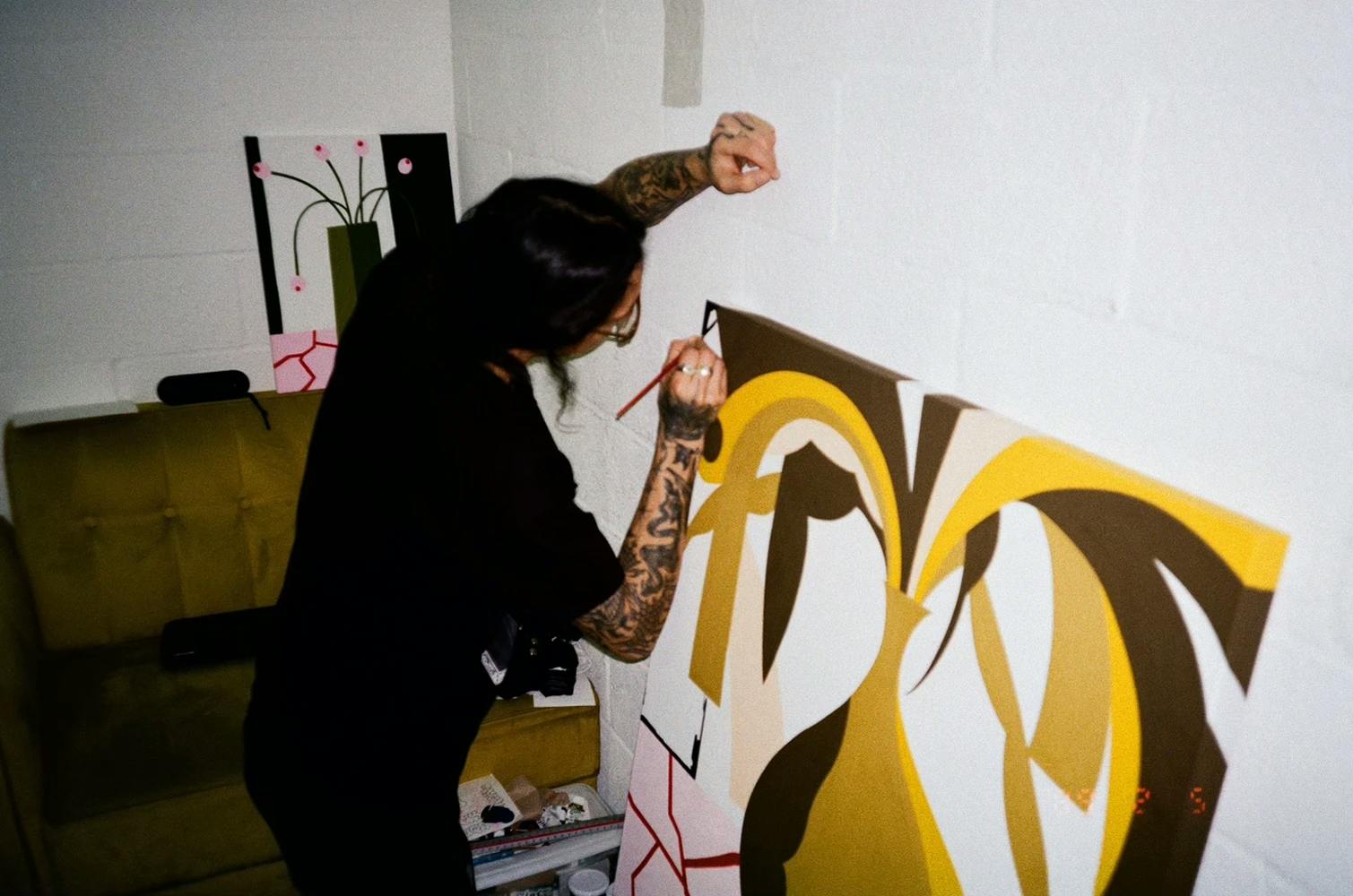 Artist Eddie Perrote paints in his studio.