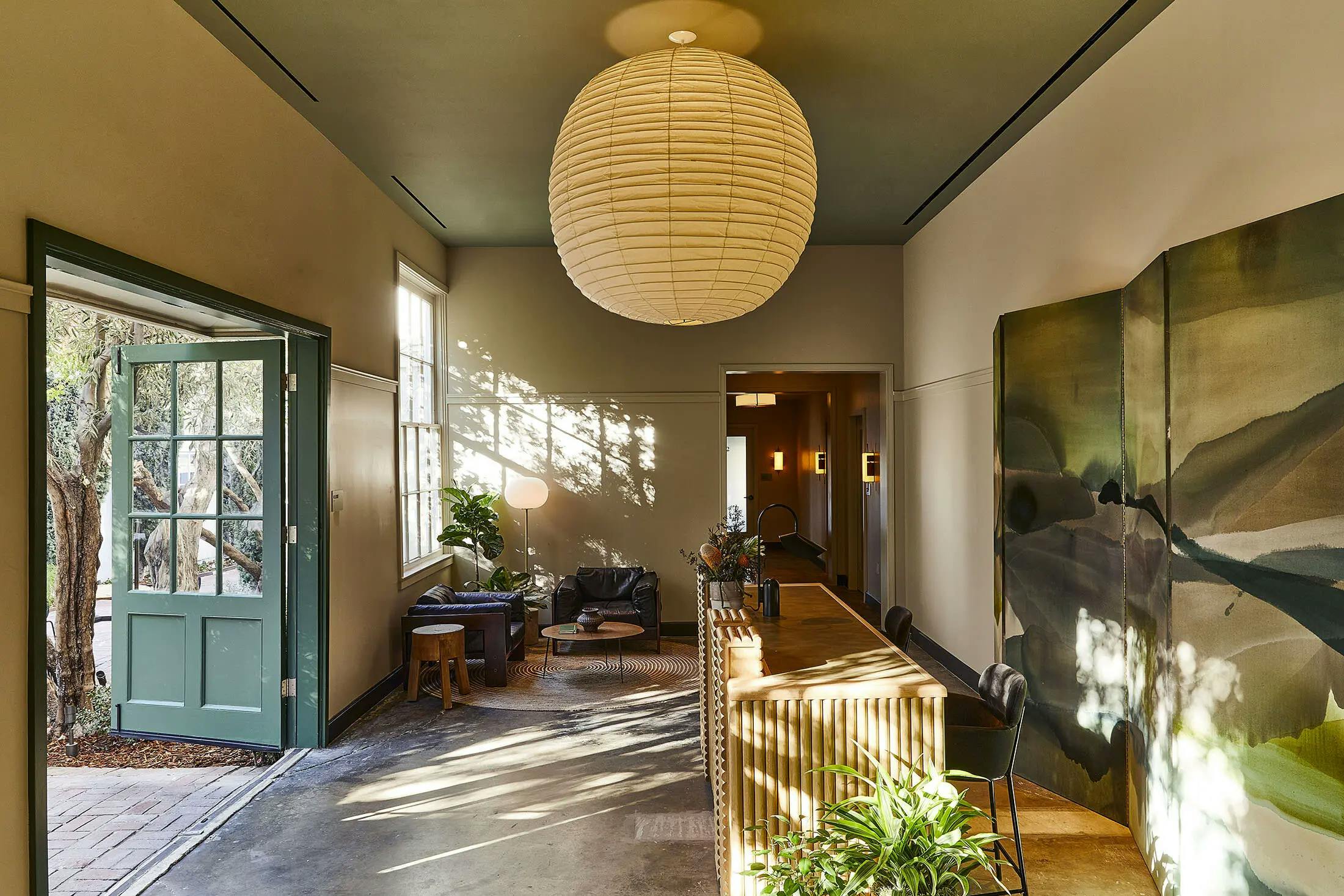 A custom painted screen within a corridor to the outside patio at the Chief Los Angeles Clubhouse.