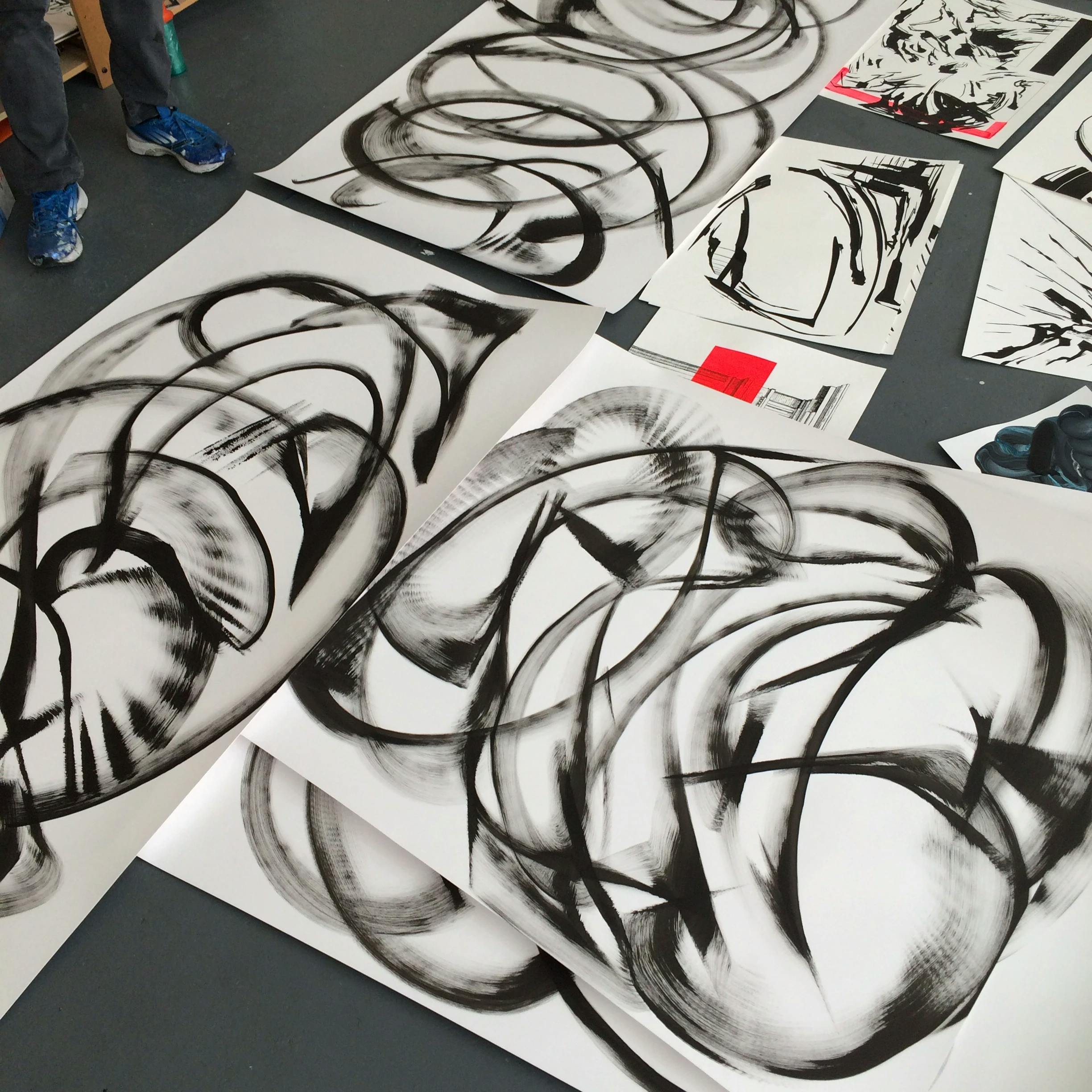 Stacks of circular swaths of black and white ink on paper by artist Thomas Hammer.