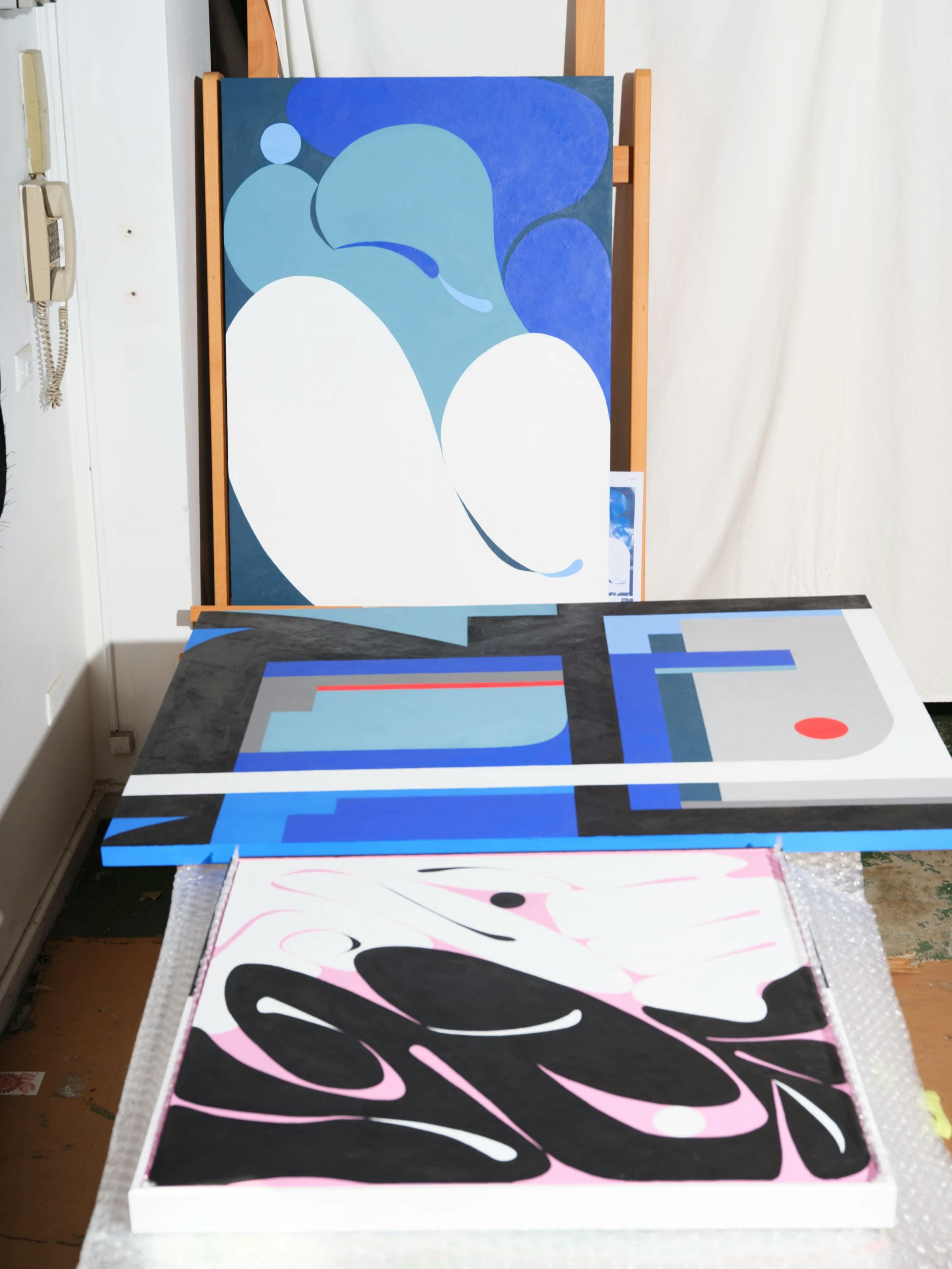 Three graphic paintings in Evi O's studio.