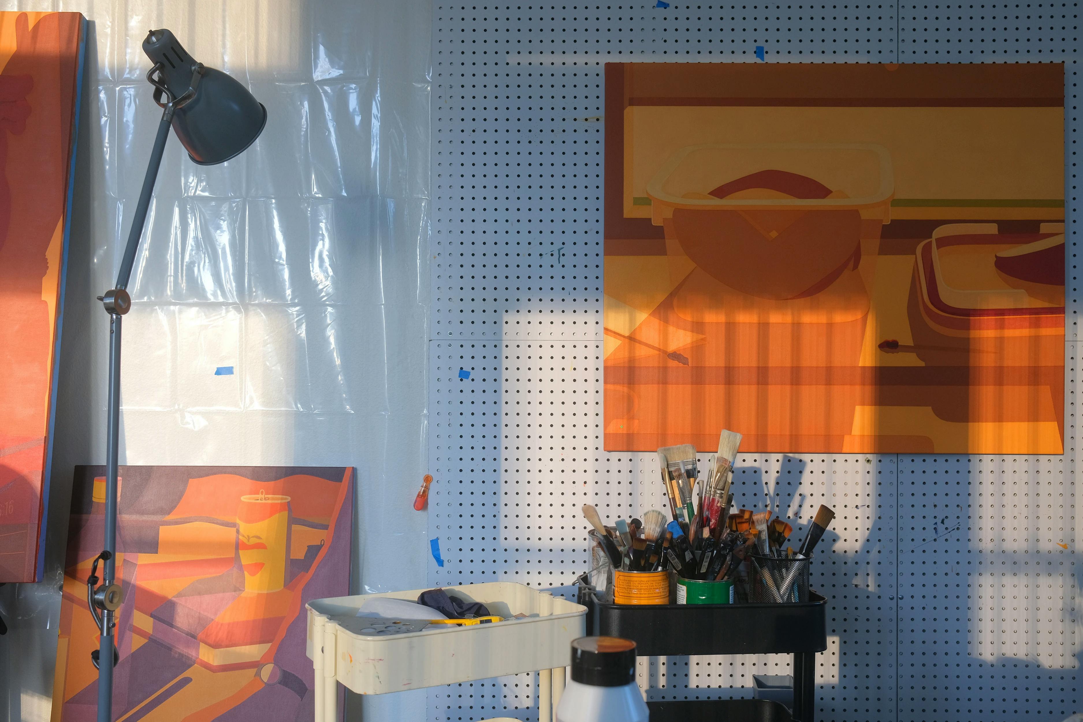 Three orange paintings in Adrian Kay Wong's studio