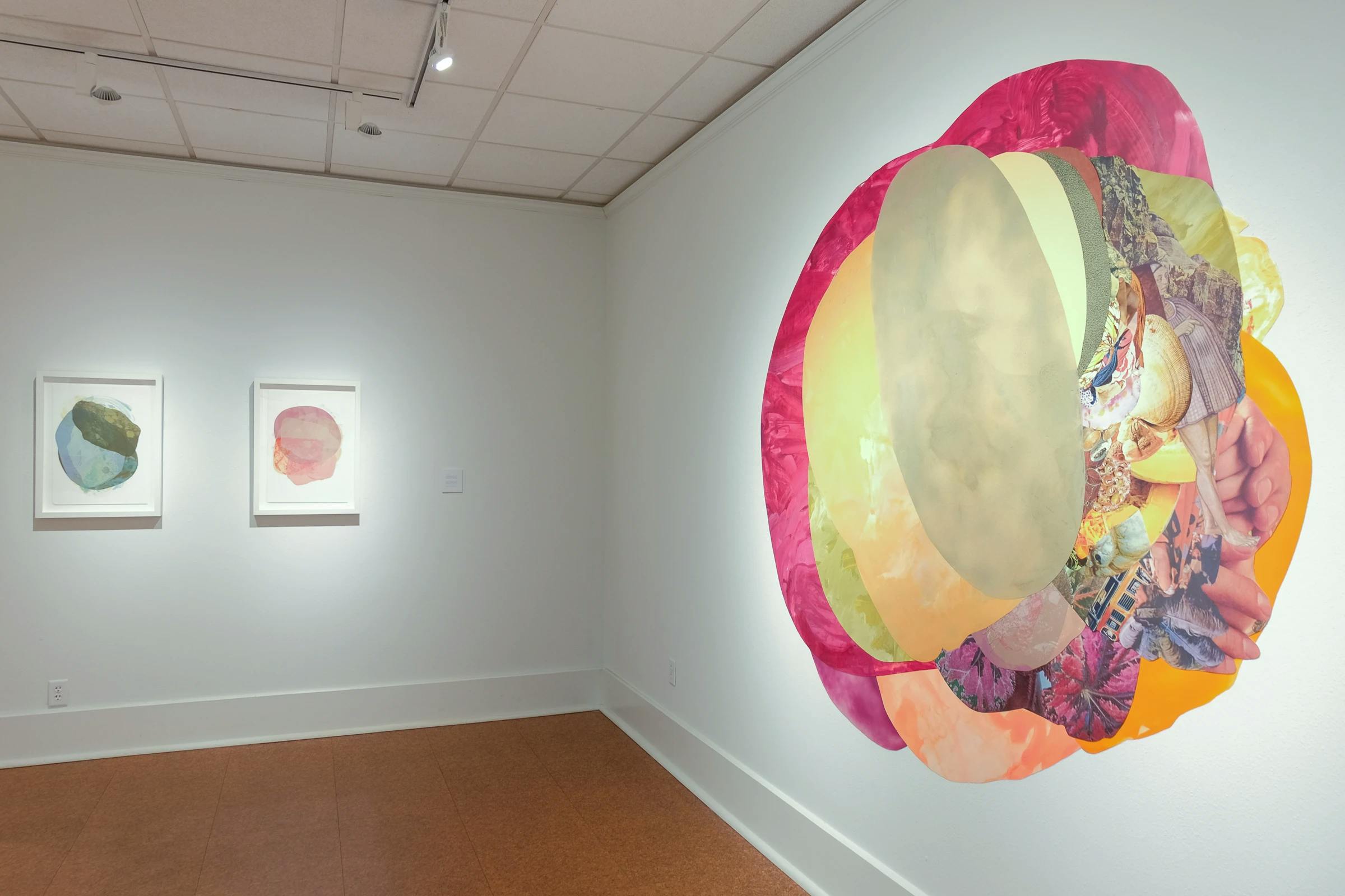 Three mixed-media collages by artist Xochi Solis, two framed and one large site-specific work, installed on a white wall in the Galveston Arts Center.